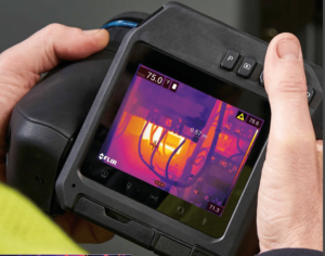 A person undergoing infrared training with a FLIR T530.