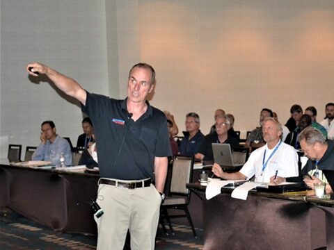 A man providing infrared training to a group of people.